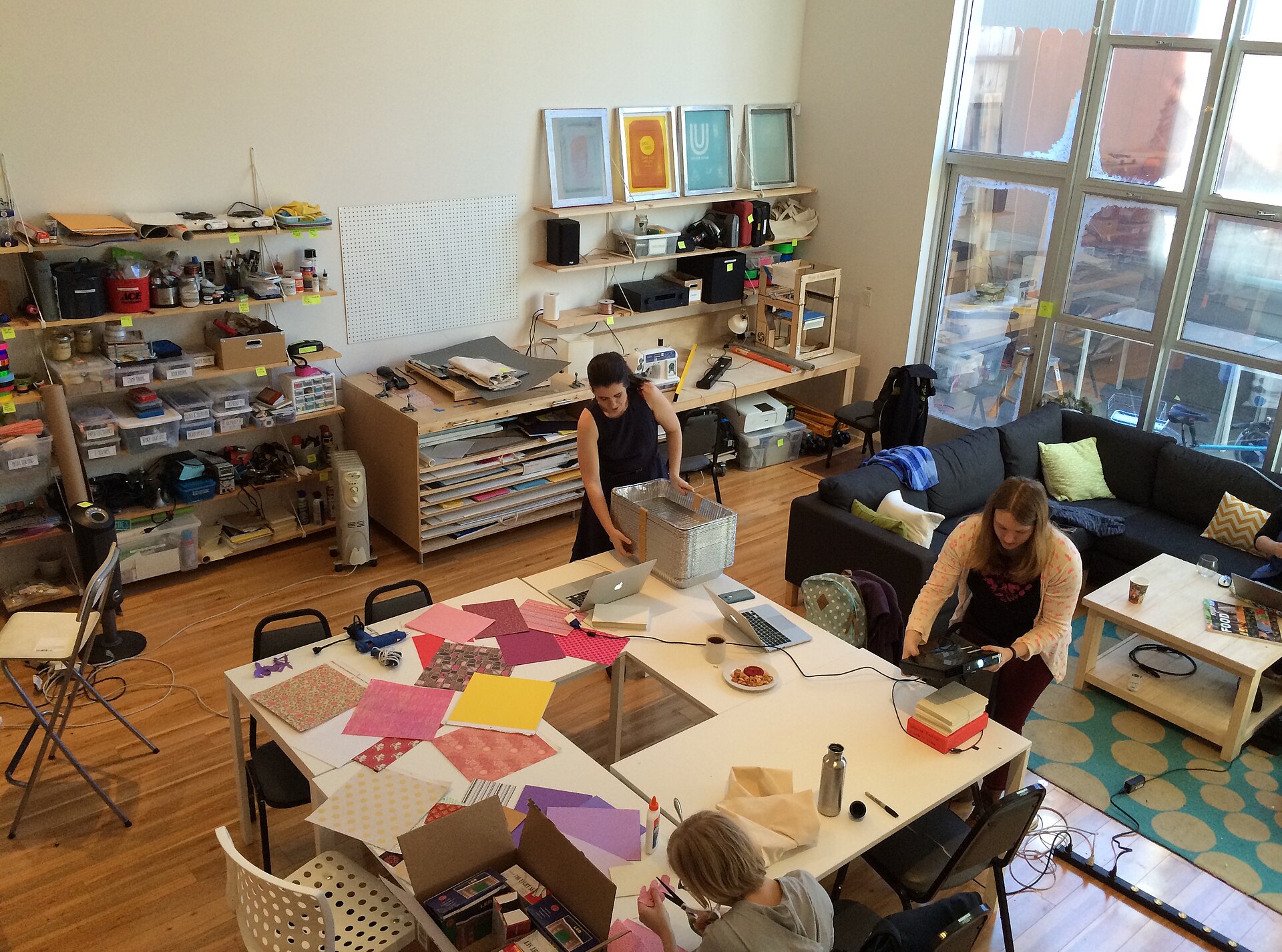 Members working together at benches in a community workshop